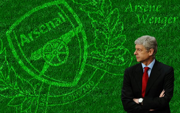 Man in formal suit with crossed arms standing in front of a passion logo on a green grass background.