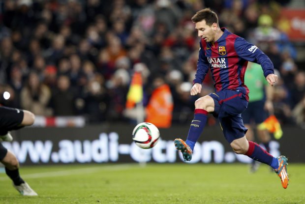 Barcelona's Lionel Messi kicks to score a goal during their King's Cup quarter-final first leg soccer match in Barcelona