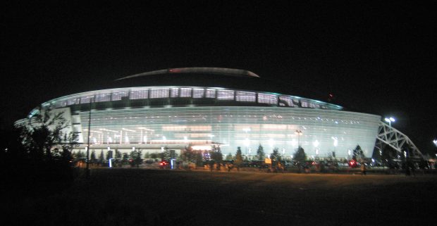 Dallas cowboys stadium at night.
