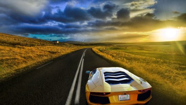 Lamborghini aventador driving into sunset wallpaper.