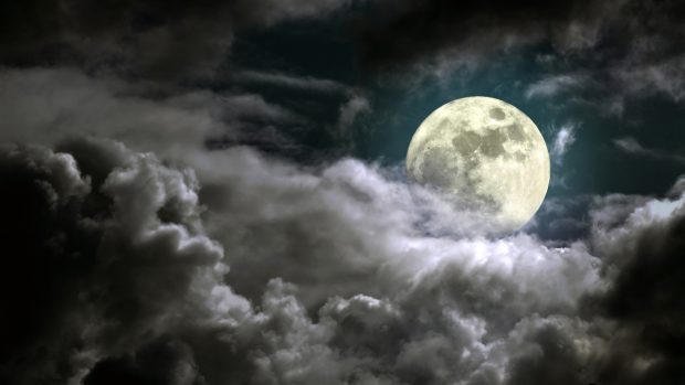 Moon Behind The Clouds Wallpaper.