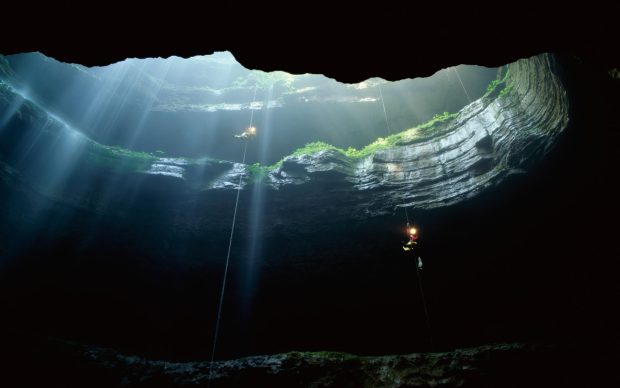 Spelunkers rappel into Neversink Pit, Jackson County, Alabama