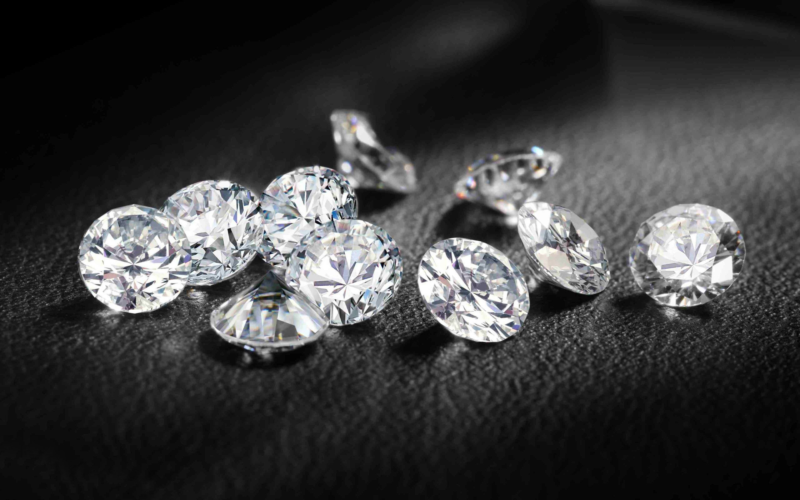 Download Striking diamonds glimmer against a dark backdrop  Wallpaperscom