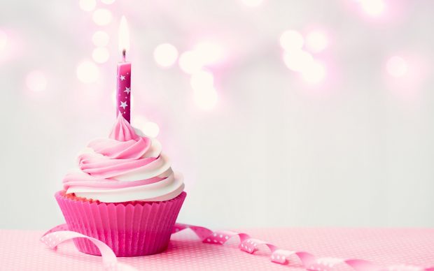 Happy birthday images pink cake with candle light.