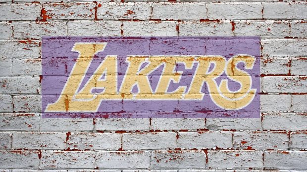 Lakers logo on grey brick wall HD download.