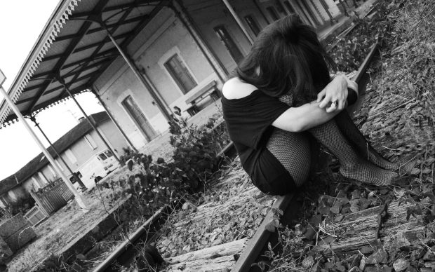 Emo Girl sitting on the rails.