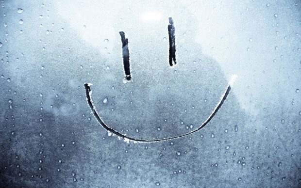 Smiley Face On a Frozen Background.