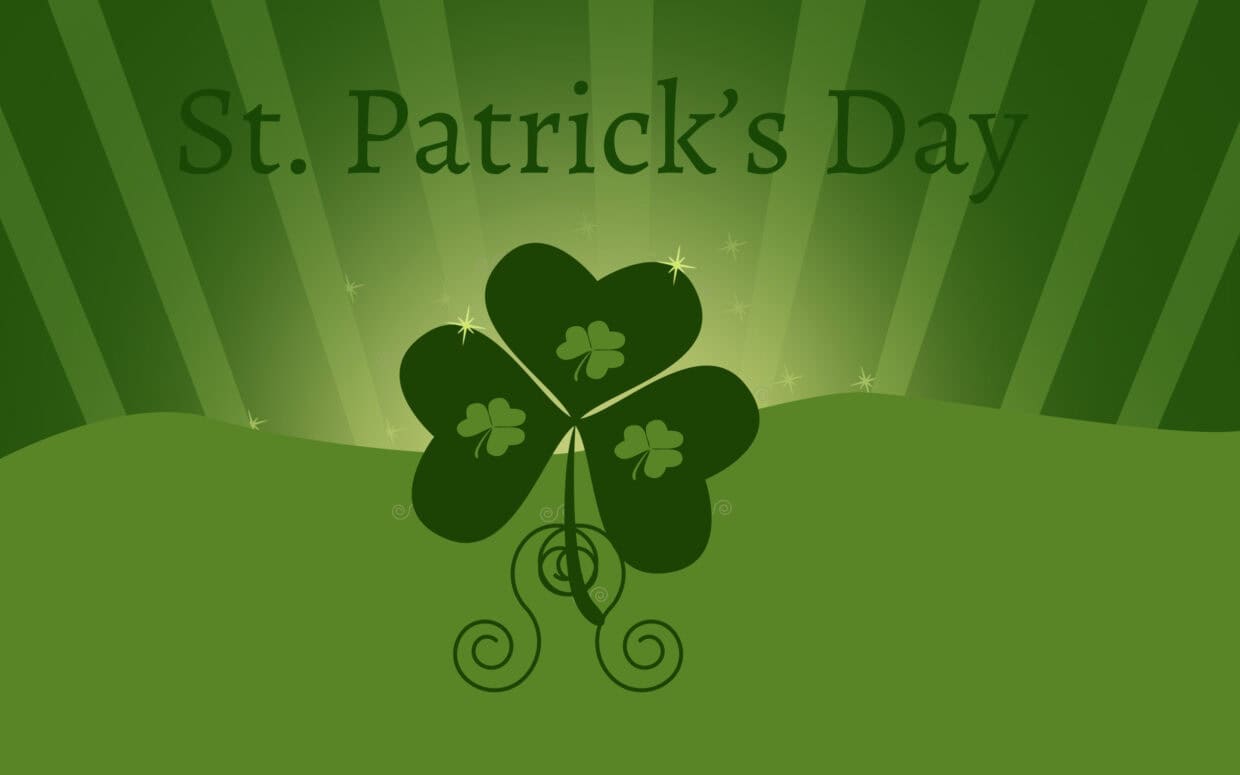 St patrick's day shamrock with three-leaf clovers and festive green background.