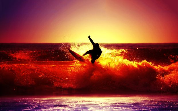 HD wallpaper surfing ocean sunset.