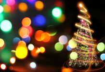 Bright Christmas tree with sparkling lights and colorful bokeh background, festive holiday decorations, holiday lights, Christmas celebration, holiday season illumination.
