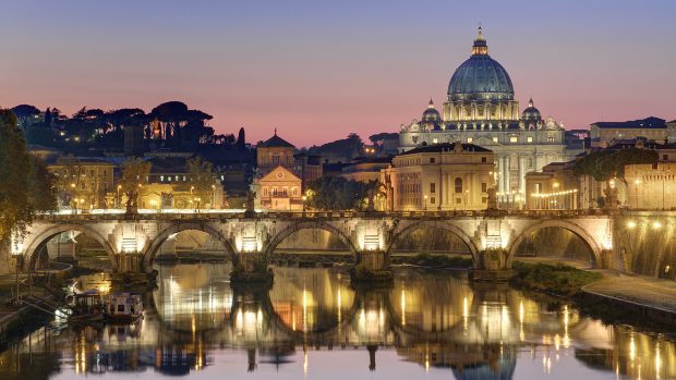 Italy, Lazio, Rome, historical center lited as World Heritage by UNESCO, Sant' Angelo bridge (Sant' Angelo ponte) above Tiber river and Saint Peter's basilica
