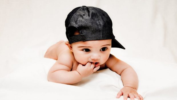 Baby Boy Wearing Black Cap iPhone Wallpaper.