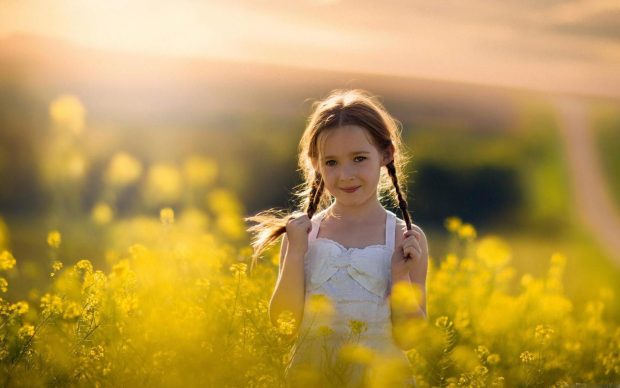 Cute Baby Girl in Yellow Flowers Field HD Desktop Backgrounds.