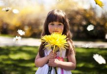 Cute Girl With Yellow Flower Best Wallpapers.