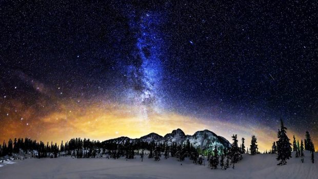 Milky Way Above The Snowy Mountains Background.