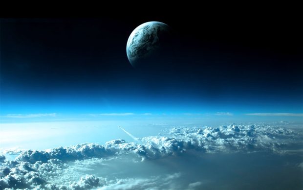 Planet on Top of Blue Clouds 1280 x 800 Wallpaper.