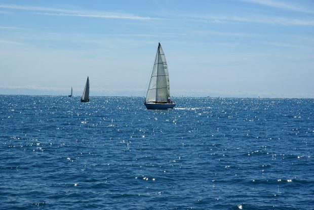 Sailboat sailing boats on a beautiful day photos.