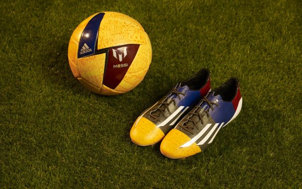 Adidas Soccer Balls and Shoes Background.