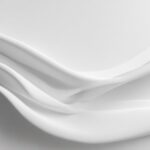 Aesthetic white background with gentle gradients and delicate shadows, perfect for a serene workspace.