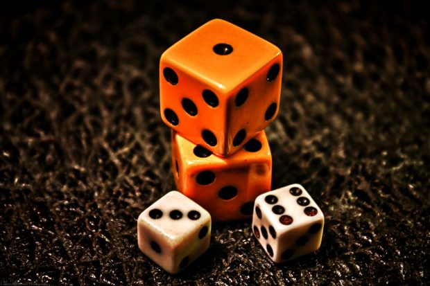 Artistic orange and white dice with sitting poses for photos.