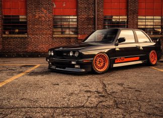 Black orange bmw m3 e30 brick building wide hd wallpaper.