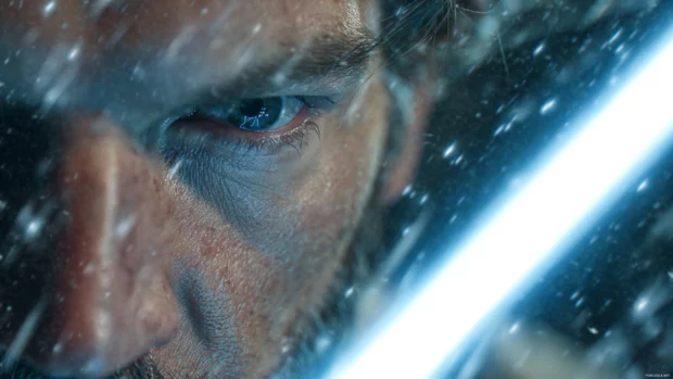 Jedi hero portrait in Star Wars Lightsaber 4K Wallpaper with glowing blade and subtle dust particles, immersive detail.