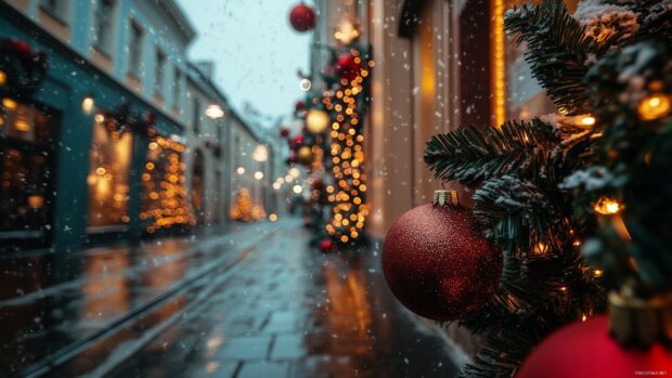 Red Christmas lights decorated on green pine branches with snowy street in the background