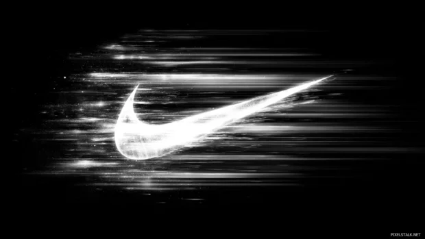 Dynamic Nike logo wallpaper that captures the essence of athleticism and movement, ideal for sports fans looking to elevate their desktop setup.