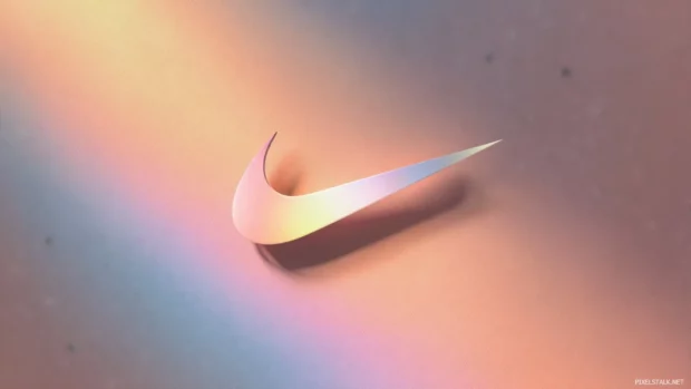 Nike logo wallpaper that emphasizes a minimalistic approach, using negative space and soft hues to create a serene desktop environment.