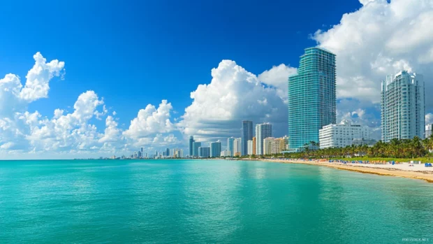 A Miami Beach ocean view with skyline in the background.