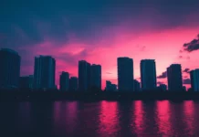 A basic cityscape of Miami at dusk with silhouettes of the skyline and a gradient sky.