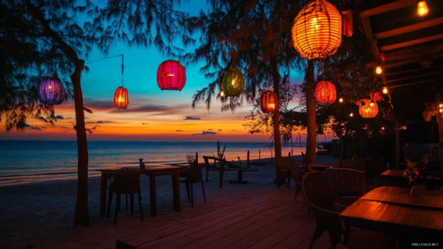 A beachside cafe with colorful lights and decorations.