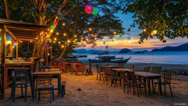 A beachside cafe with colorful lights and decorations, overlooking the ocean at sunrise.