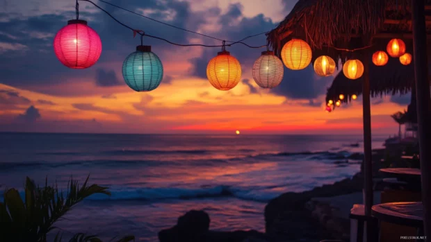 A beachside cafe with colorful lights and decorations, overlooking the ocean at sunrise.
