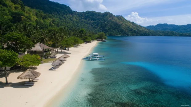 A beautiful beach with clear turquoise water and soft white sand.