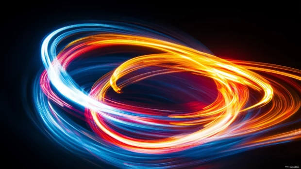 A blend of multicolored neon lights in abstract patterns against a dark background.