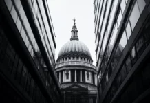 A cathedral dome contrasts with modern lines in city grayscale.