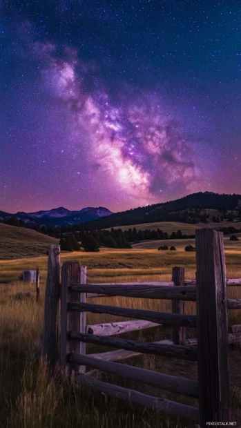 A dreamy night sky with scattered stars and a faint hint of purple and blue hues blending together.
