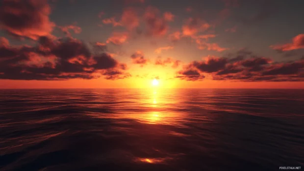 A glowing horizon marks the daybreak in this stunning sunrise wallpaper over ocean.
