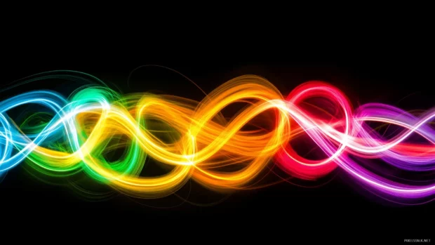 A mesmerizing blend of multicolored neon lights in abstract swirling patterns against a dark background.