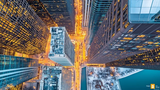A panoramic view of downtown Chicago, highlighting the Chicago River winding through modern skyscrapers.