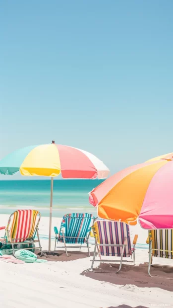 A preppy beach scene with colorful beach umbrellas, and elegant beach chairs.