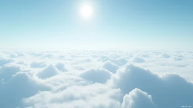 A serene blue sky with soft, wispy clouds stretching across the horizon.