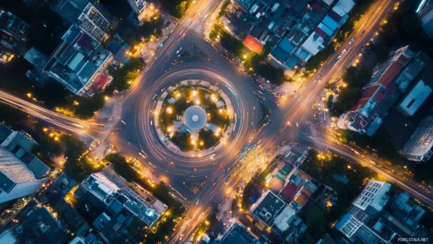 A serene city view from above, showcasing a network of bright city lights and traffic trails in a modern metropoli.