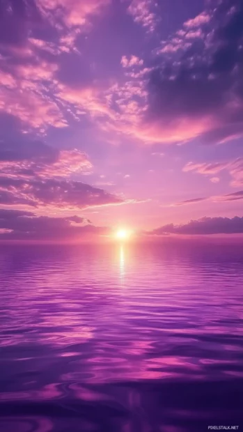 A serene purple sky with soft rolling clouds glowing from the reflection of the setting sun.