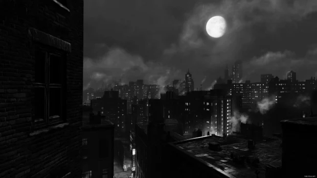 A silent night settles over the dark city, clouds drift between the buildings.