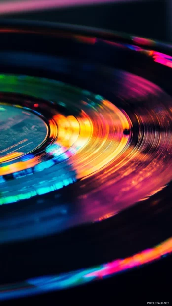 A spinning vinyl record casting rainbow reflections, Vinyl record music wallpaper iPhone.
