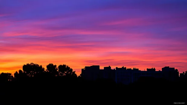 A vibrant sunset over South Beach, with Art Deco hotels.
