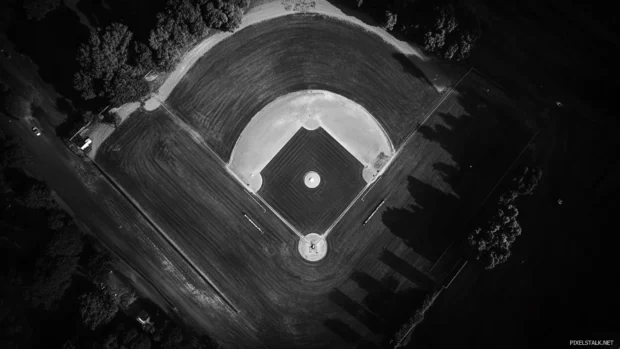 Aerial shot of a baseball diamond in full black and white contrast.