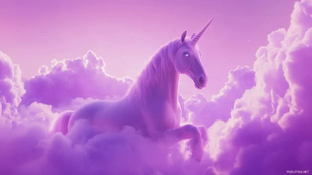 Among purple skies and cotton candy clouds, the unicorn glows with magic in this unicorn wallpaper.